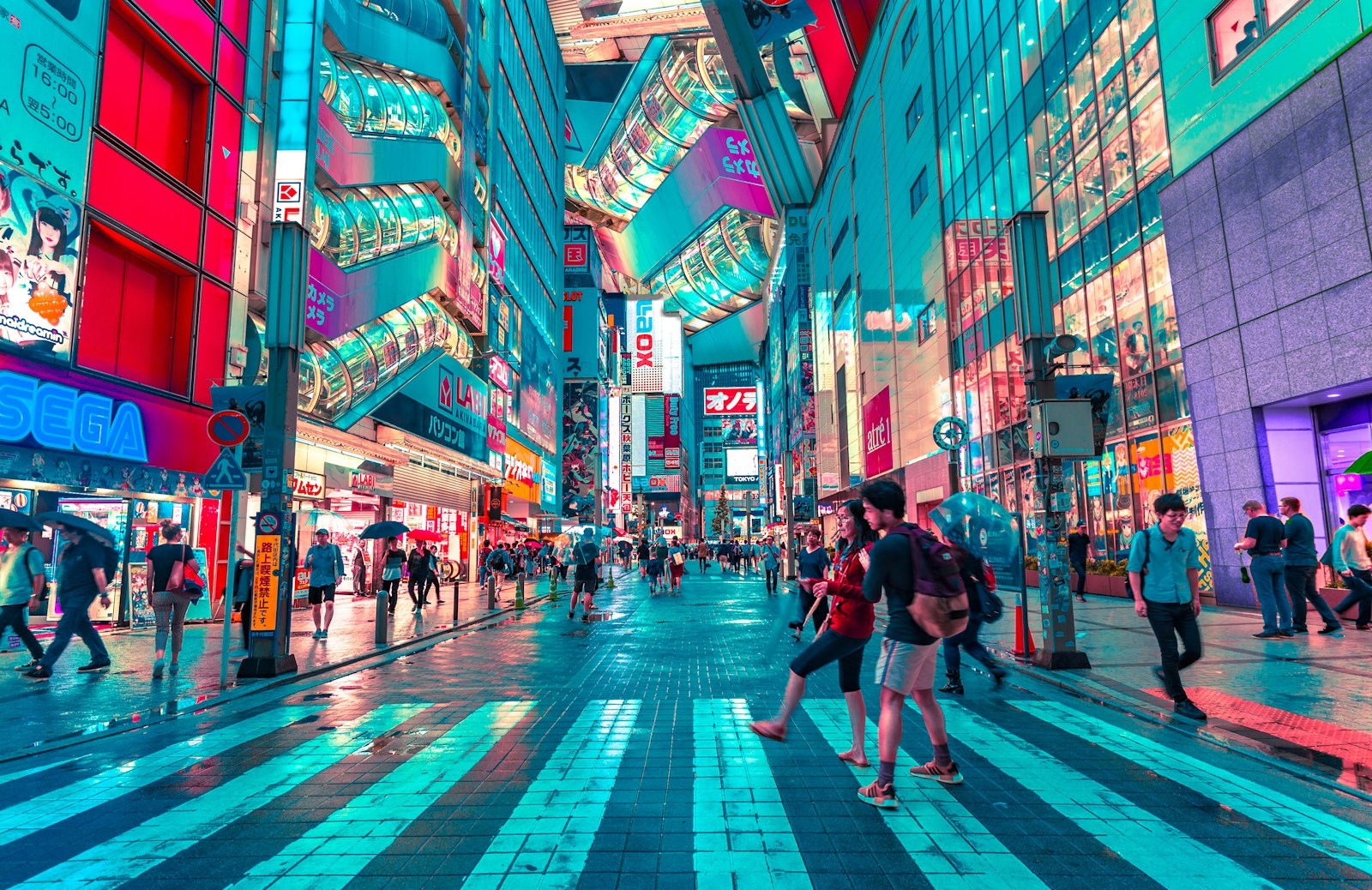 A busy city street lit up at night